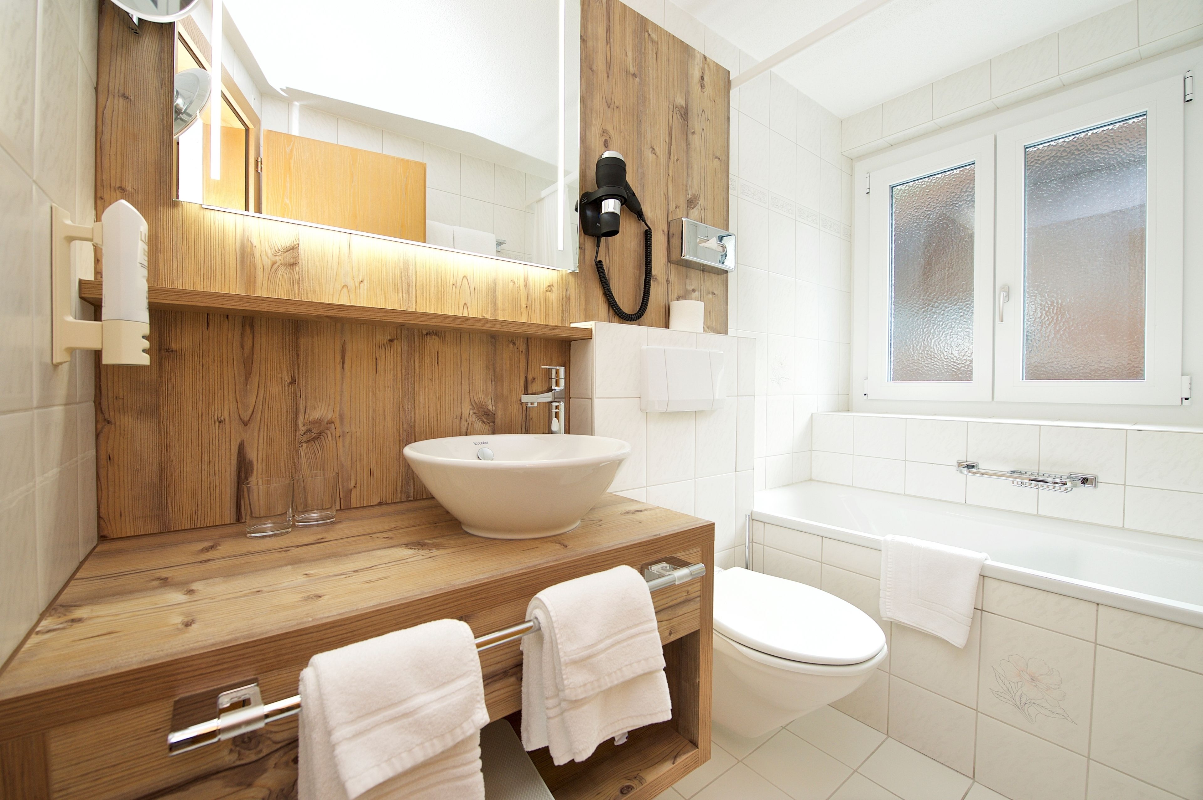 deluxe double or twin room, balcony, mountain view | bathroom | hair dryer, bathrobes, slippers, towels