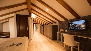 Alpine Roof Suite | Hypo-allergenic bedding, minibar, in-room safe, blackout drapes