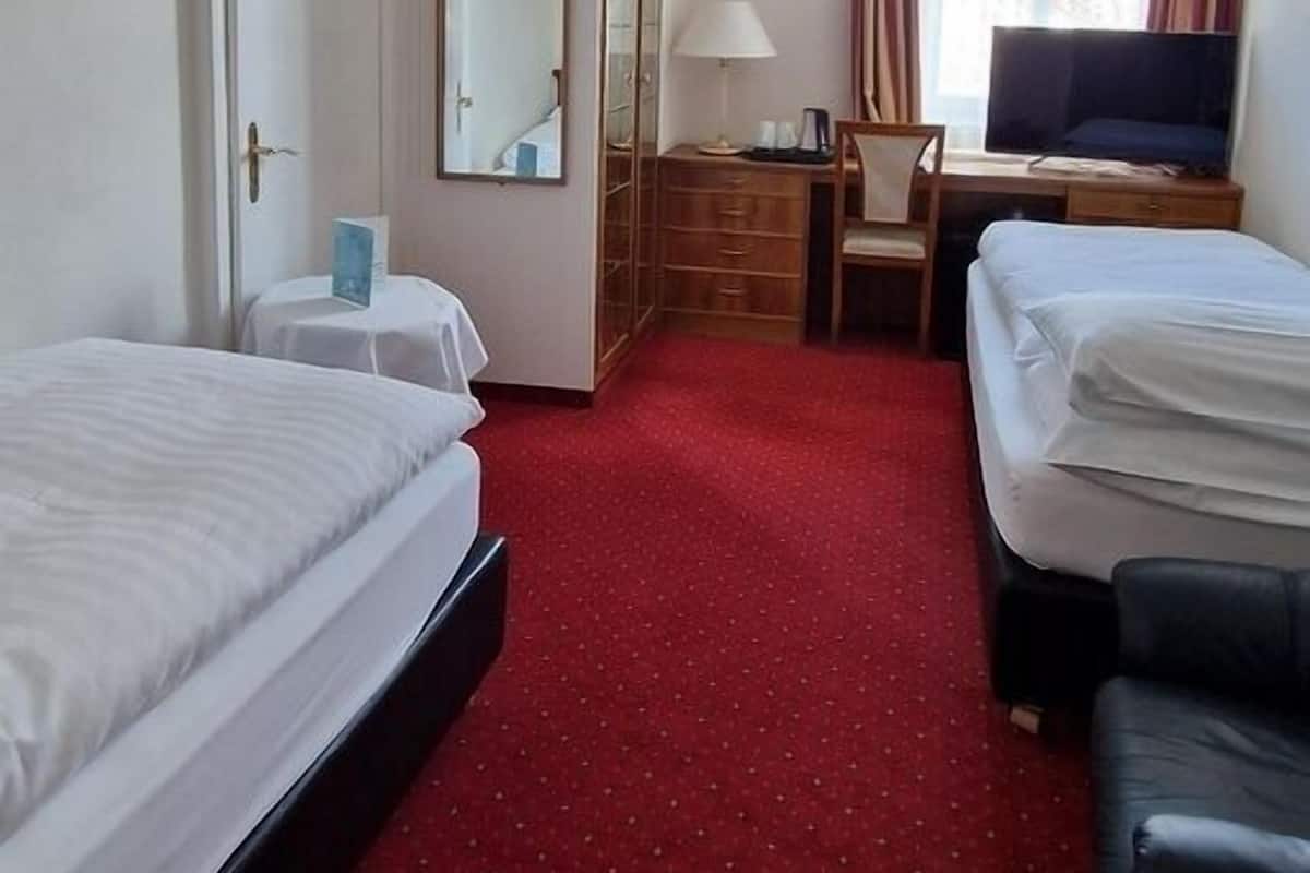 Standard Quadruple Room, City View | Minibar, in-room safe, desk, free WiFi
