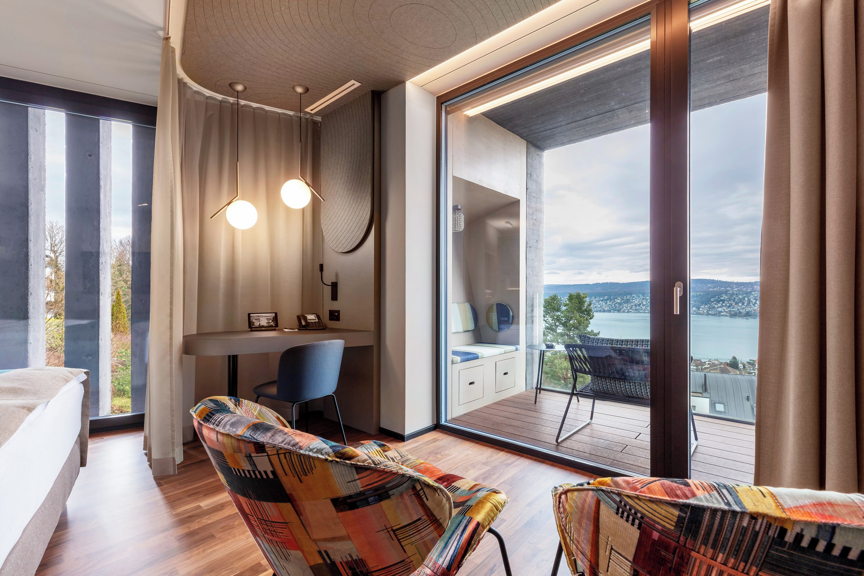 lifestyle room with lake view | 1 bedroom, premium bedding, free minibar items, in-room safe