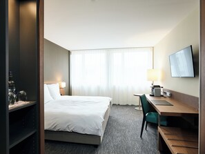 Economy kamer | Luxe beddengoed, een gratis minibar, een kluis op de kamer, een bureau