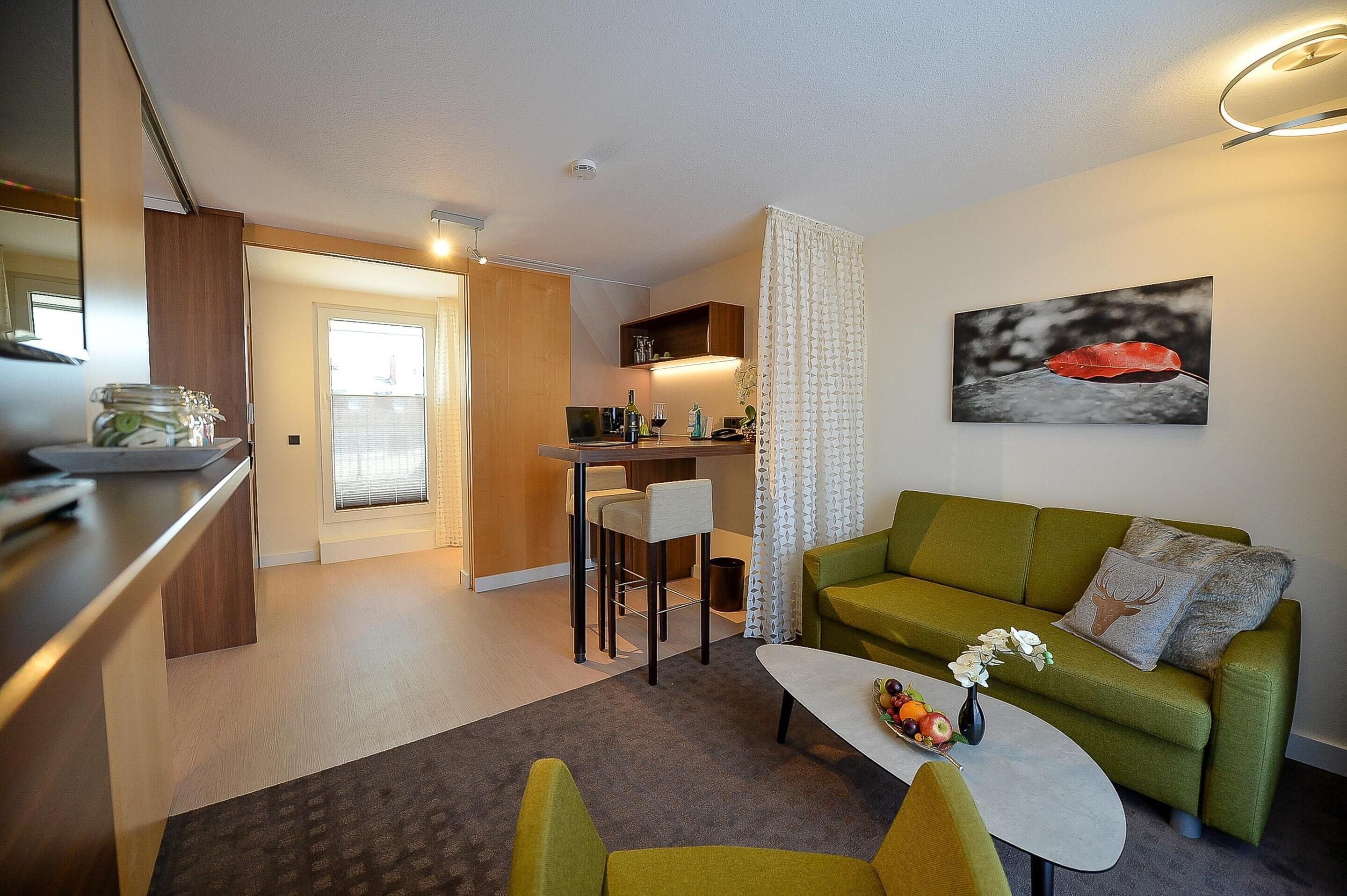 suite, 1 king bed, balcony (living room) | hypo-allergenic bedding, in-room safe, desk, laptop workspace