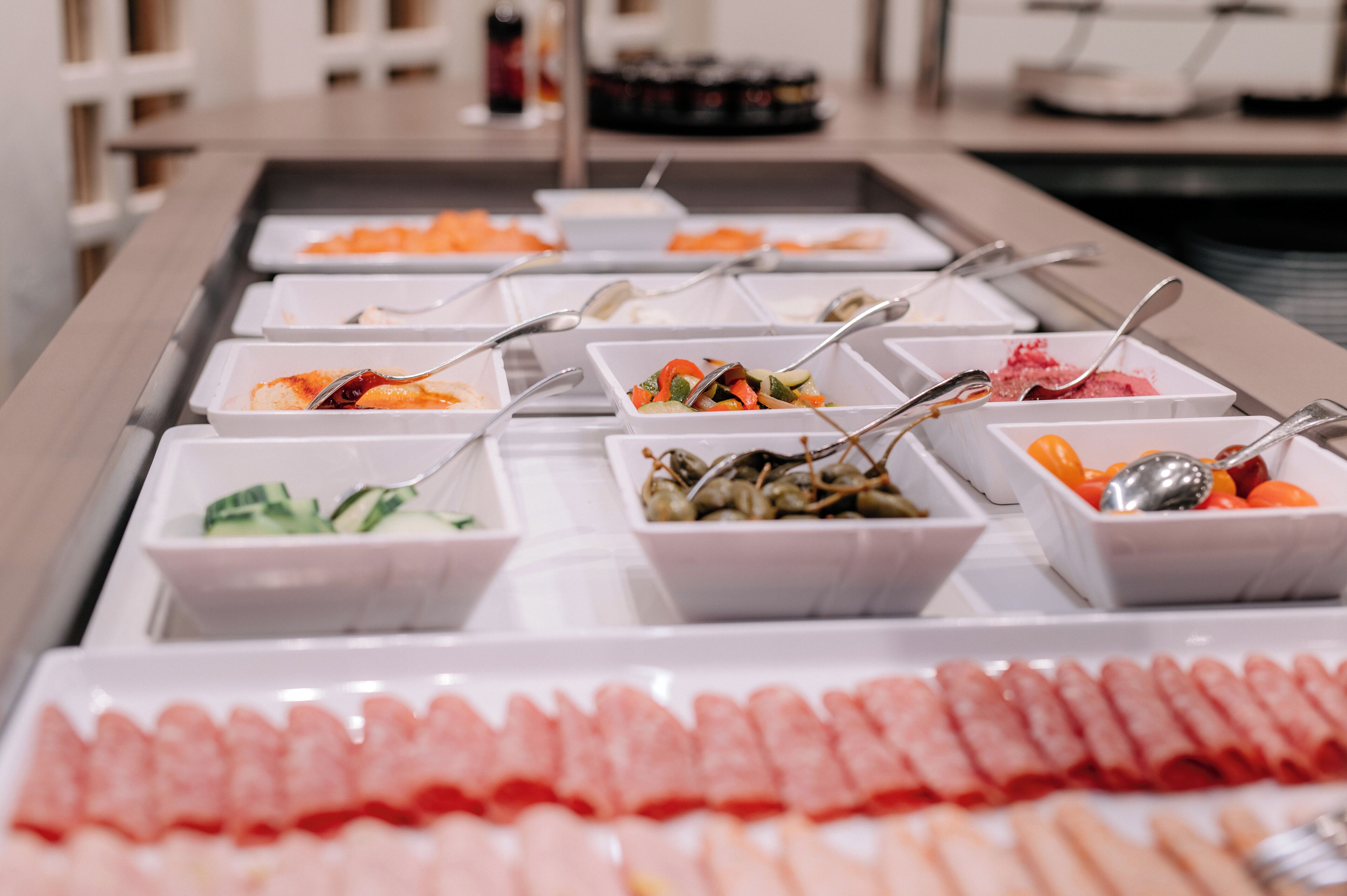A buffet with various food options including seafood, salads, and fruits.