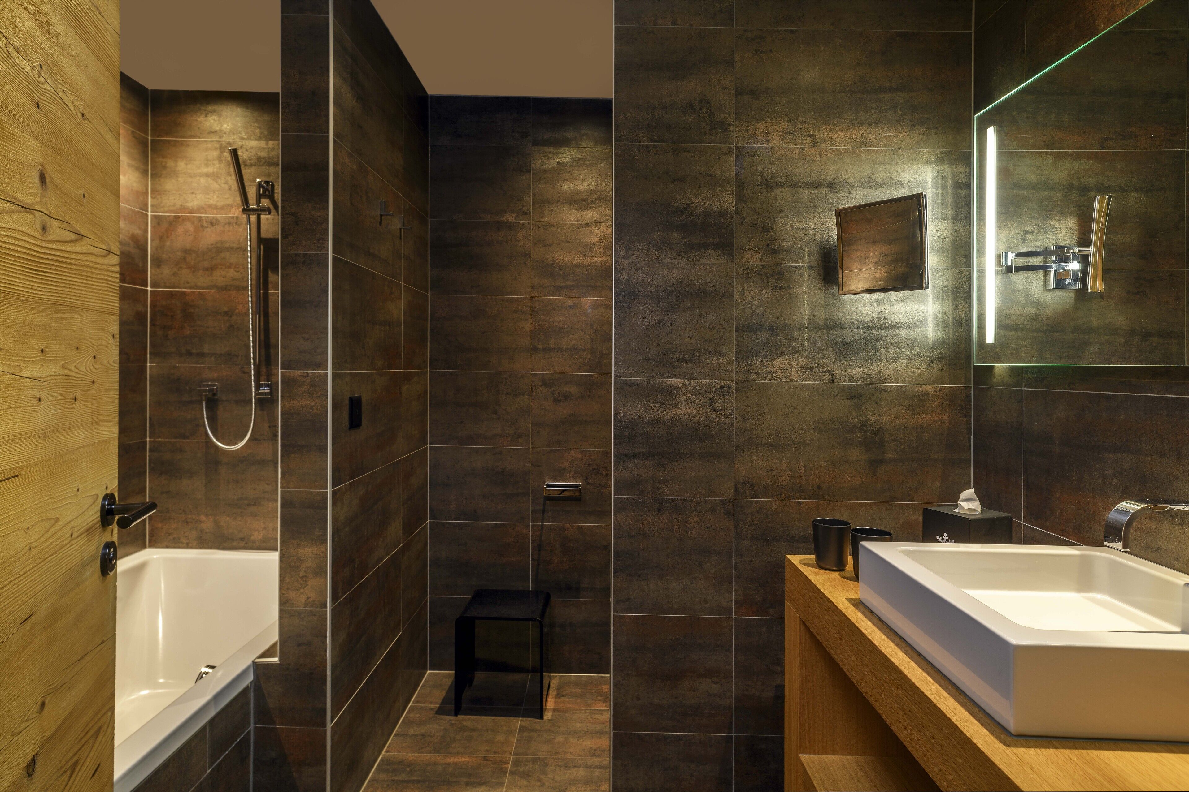 deluxe double room | bathroom | rainfall showerhead, designer toiletries, hair dryer, bathrobes