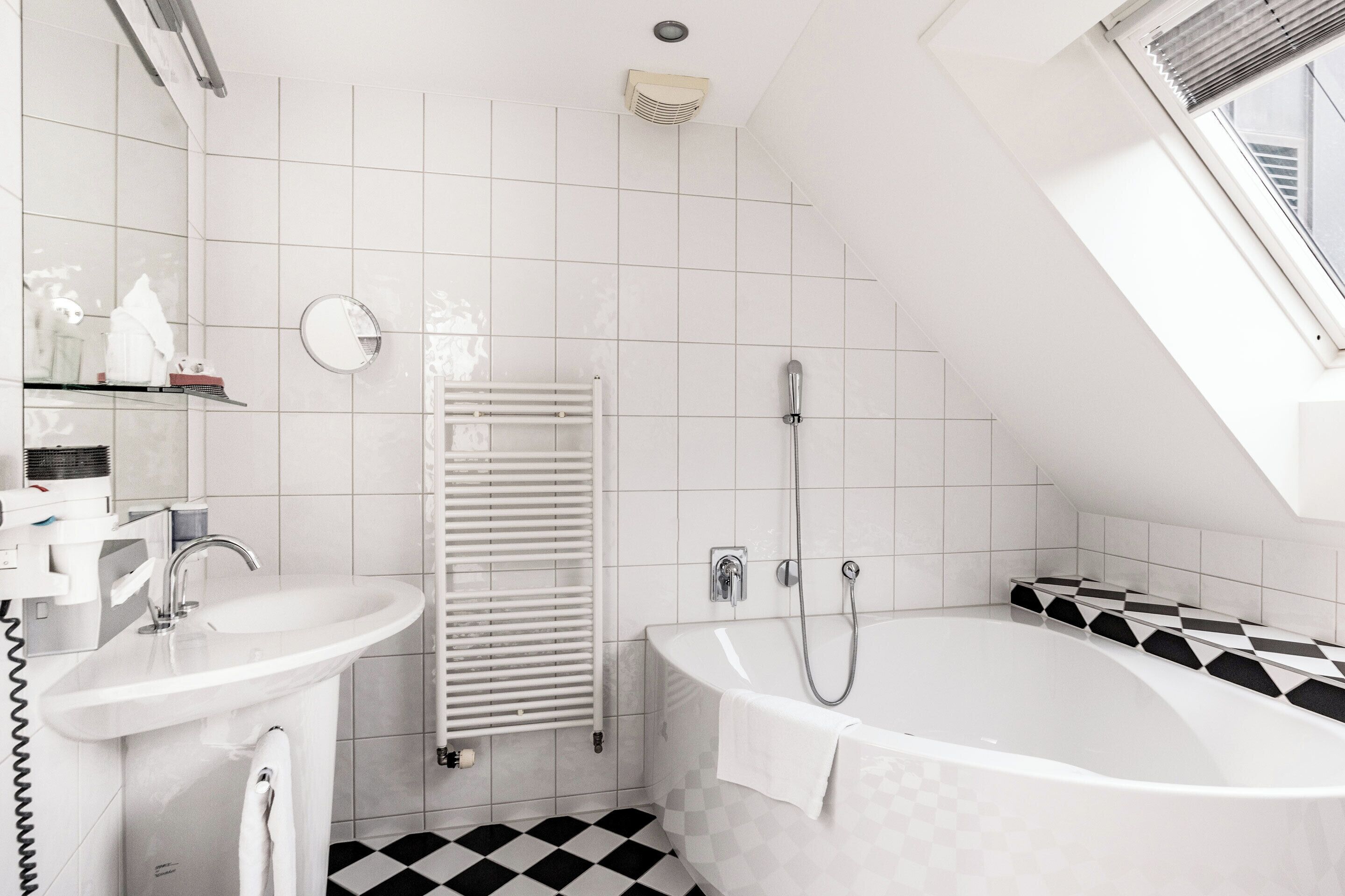 junior twin room | bathroom | shower, eco-friendly toiletries, hair dryer, bathrobes