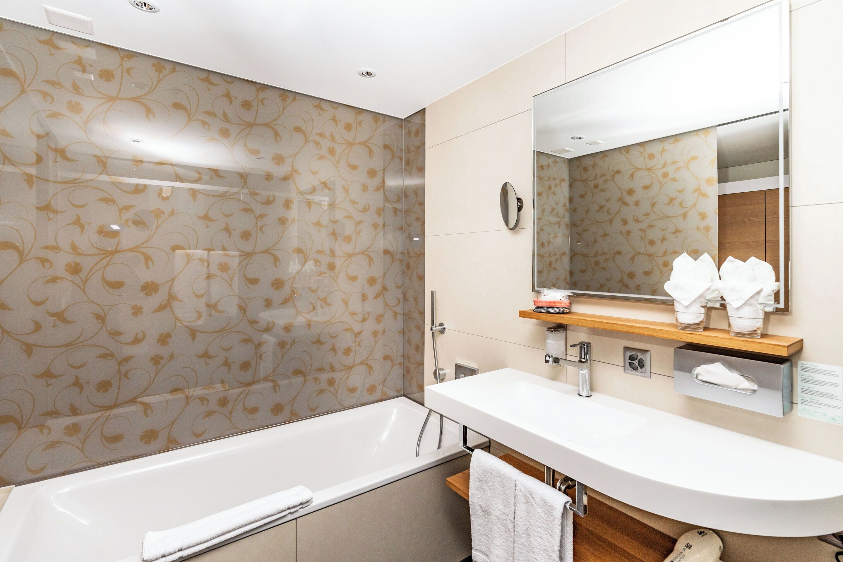junior twin room | bathroom | shower, eco-friendly toiletries, hair dryer, bathrobes