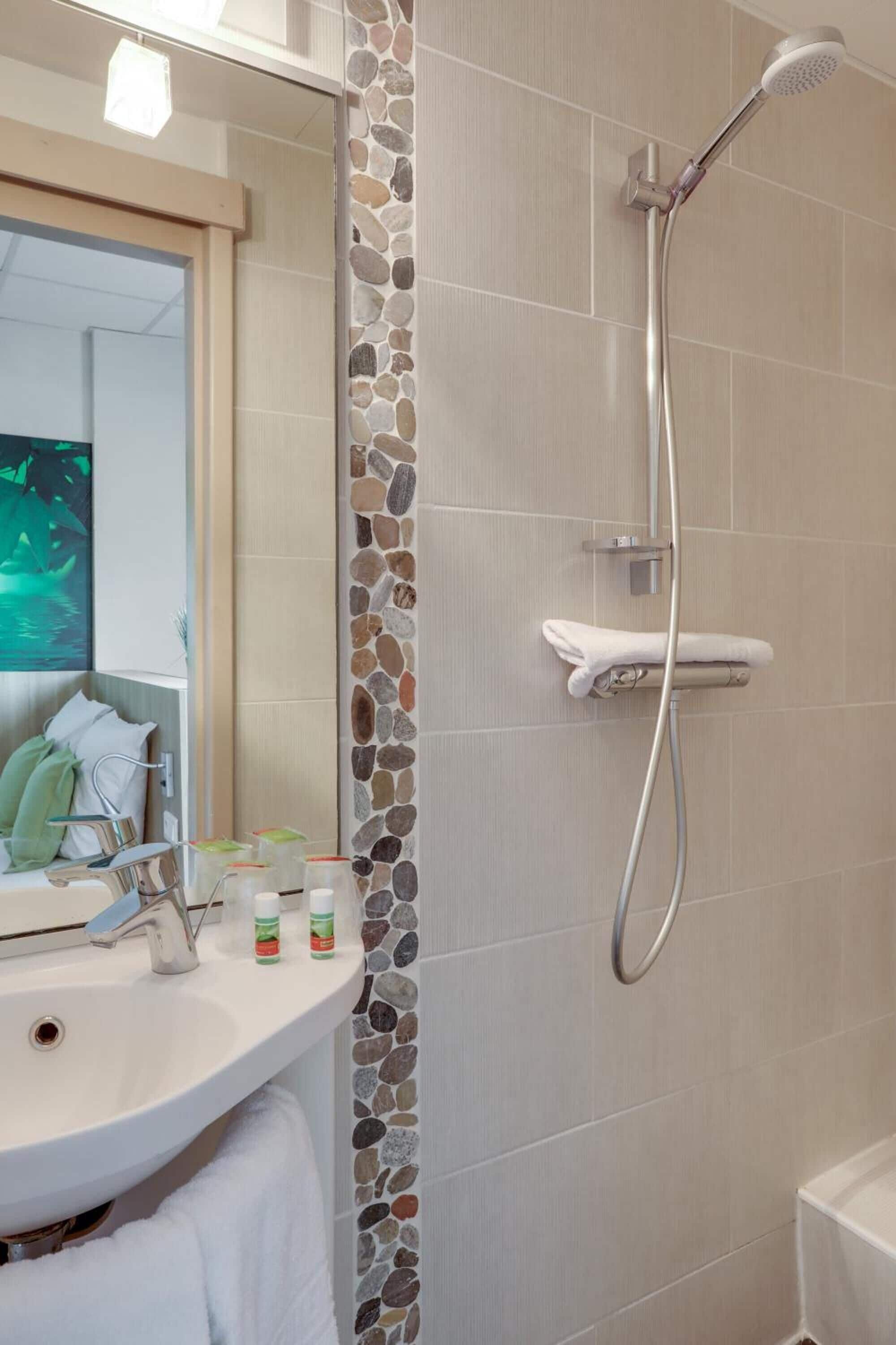 shower, free toiletries, hair dryer, towels