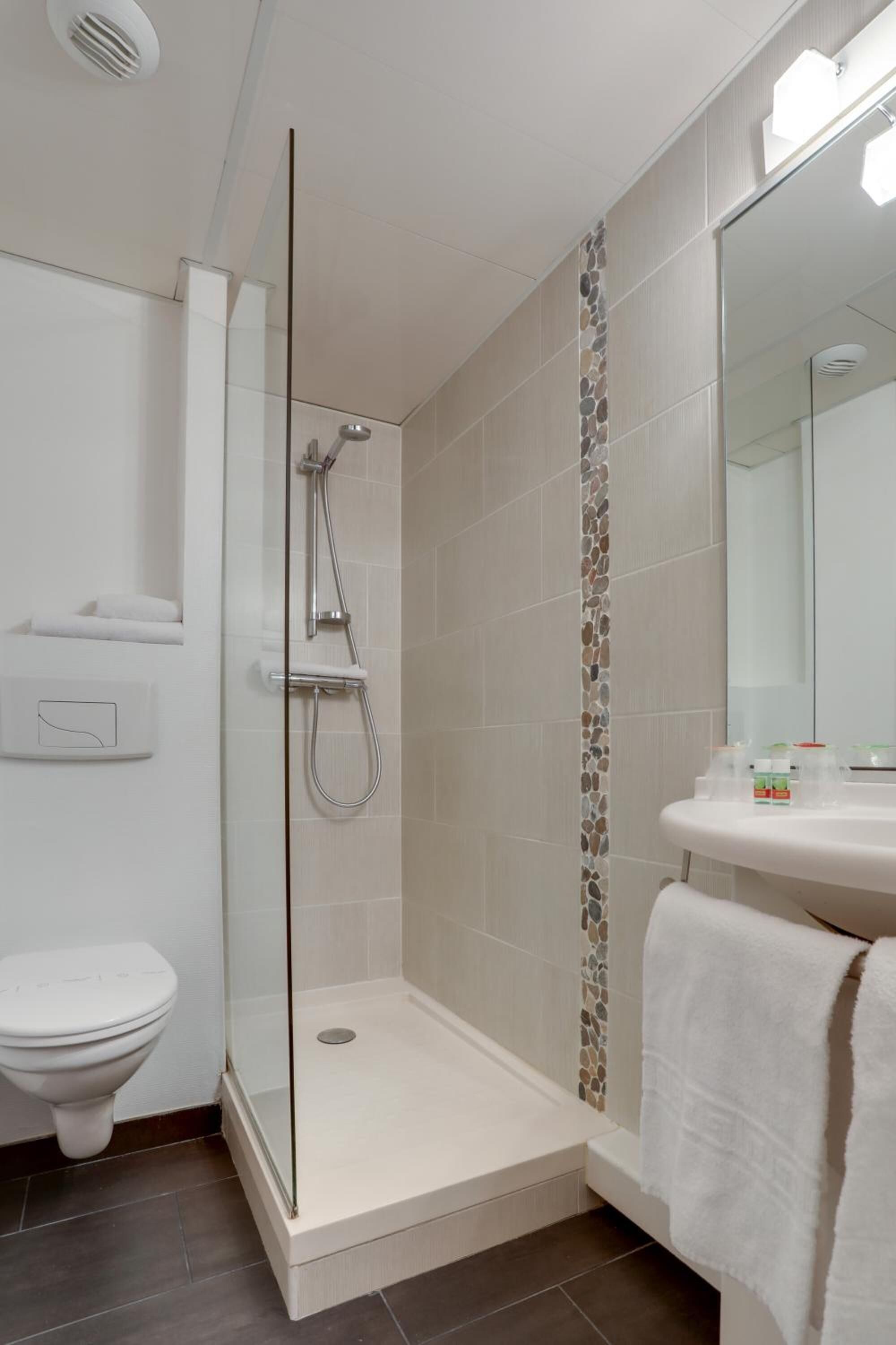 shower, free toiletries, hair dryer, towels