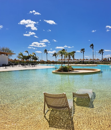 Indoor pool, 2 outdoor pools, pool umbrellas, sun loungers