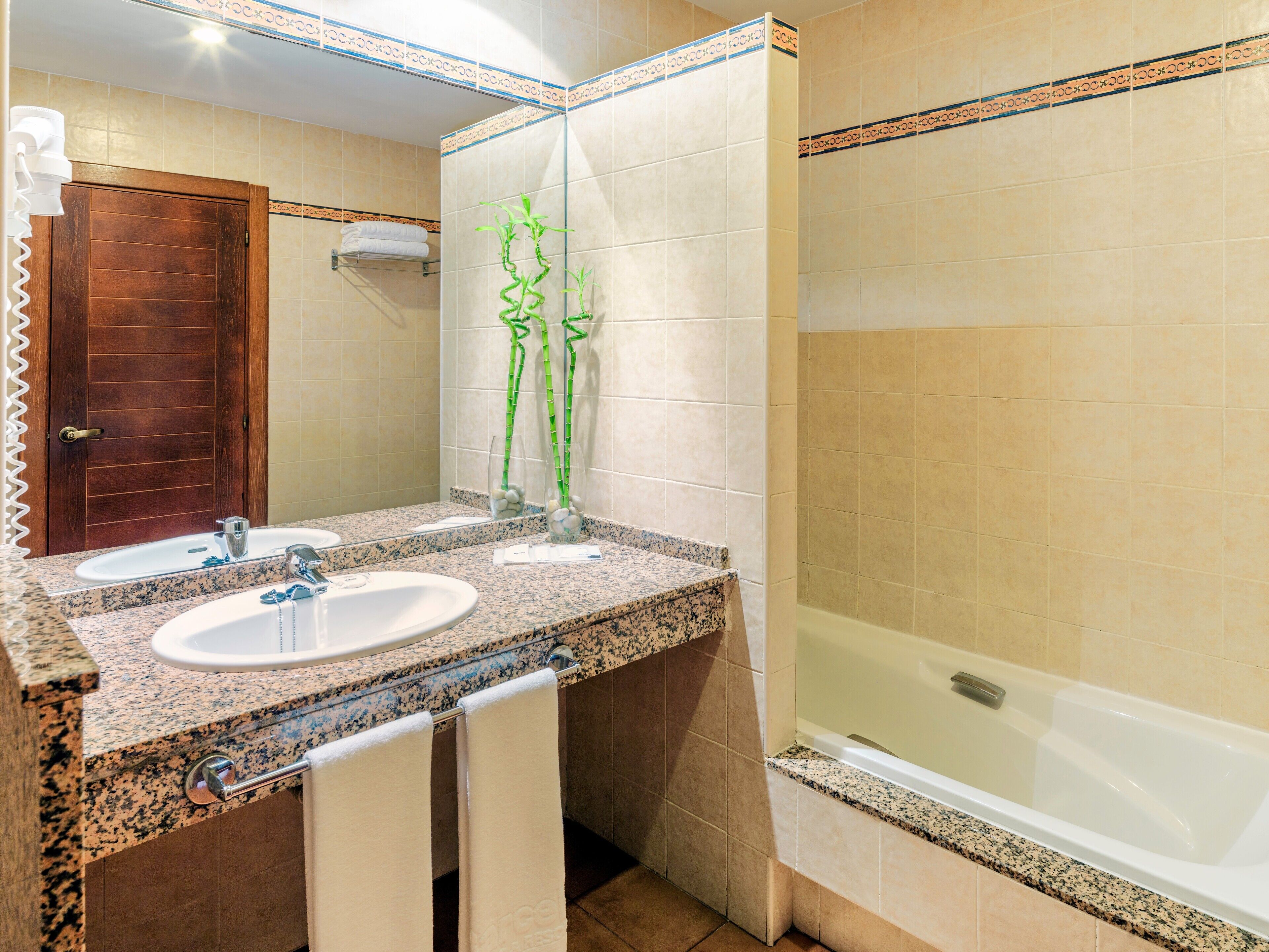 bathtub, free toiletries, hair dryer, towels