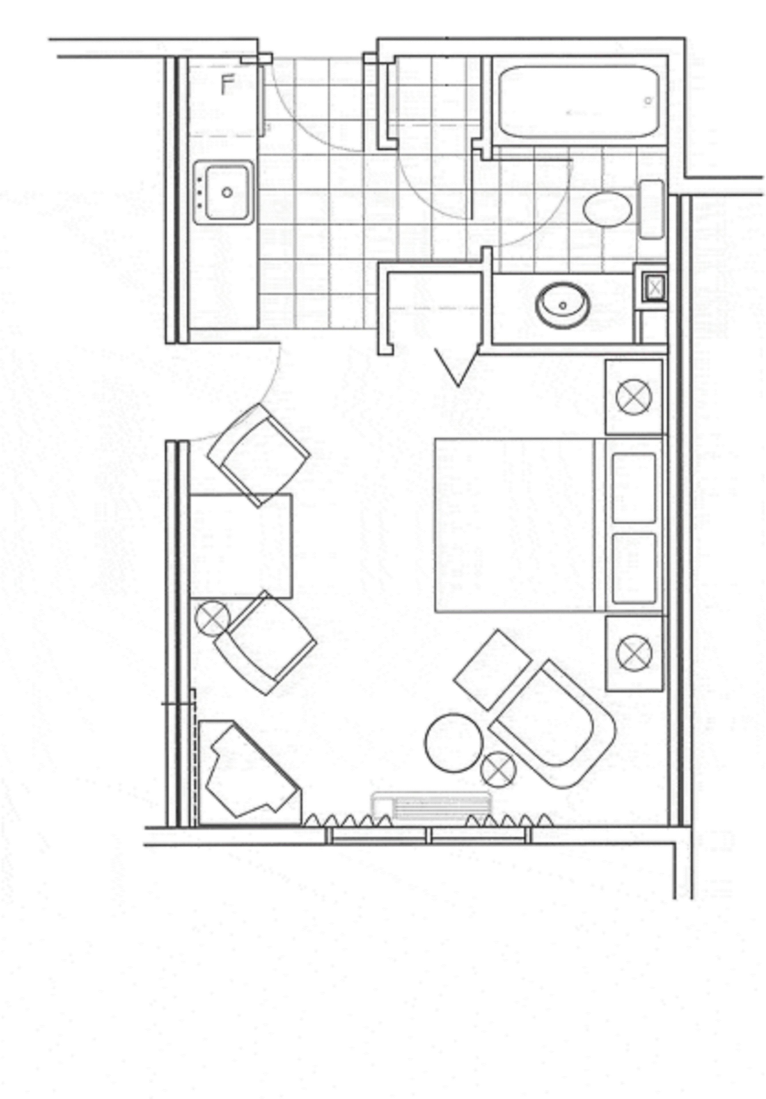 A floor plan of a hotel room with a kitchenette, a bathroom, a seating area, and a small table.