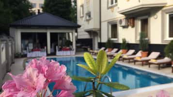 Outdoor pool, open 8:00 AM to 8:00 PM, free cabanas, pool umbrellas