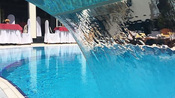 Outdoor pool, open 8:00 AM to 8:00 PM, free cabanas, pool umbrellas