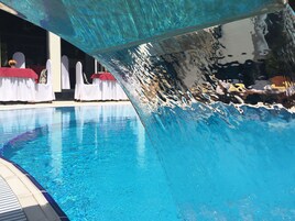 Outdoor pool, open 8:00 AM to 8:00 PM, free cabanas, pool umbrellas