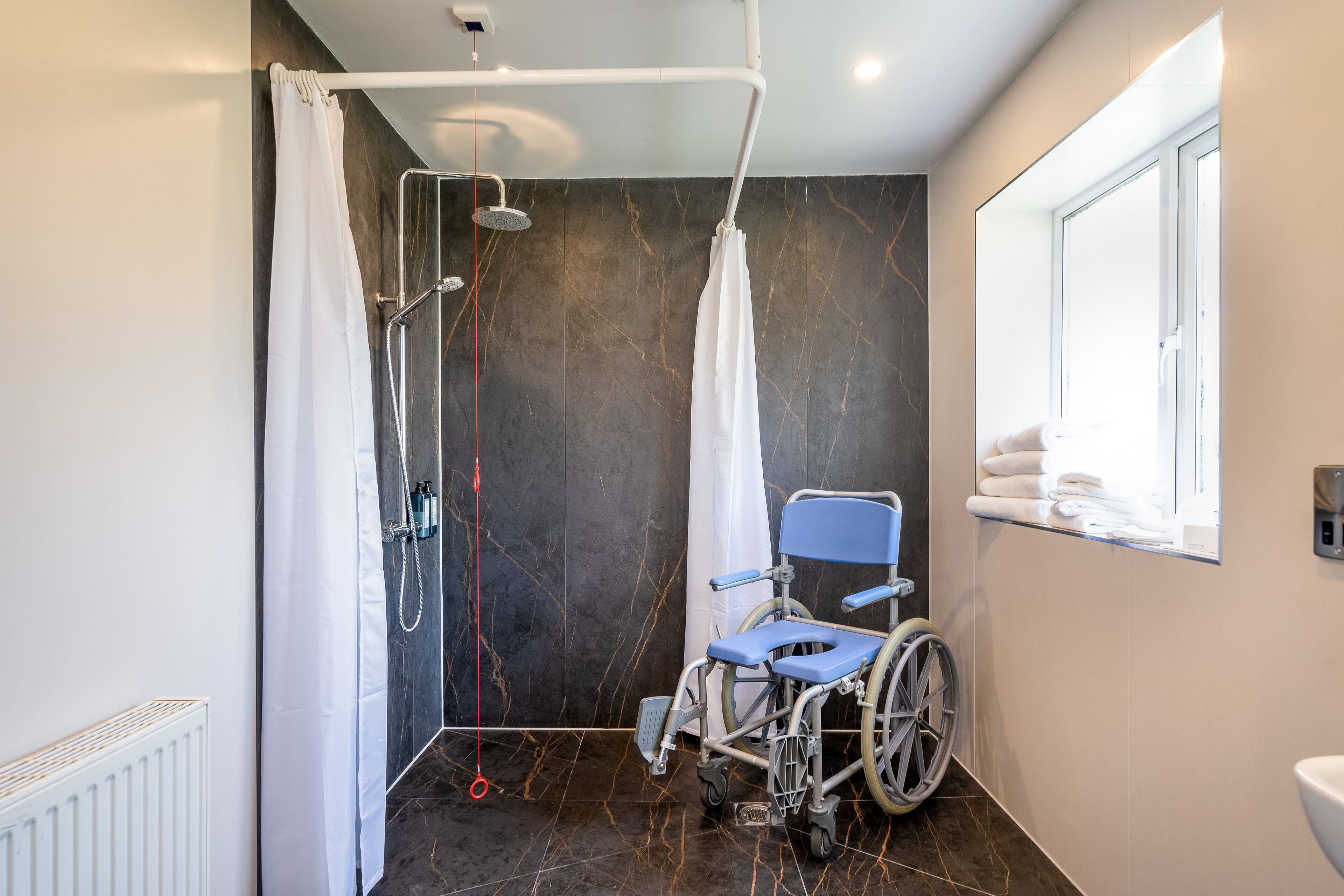 accessible twin room with walk in shower | bathroom | free toiletries, hair dryer, towels