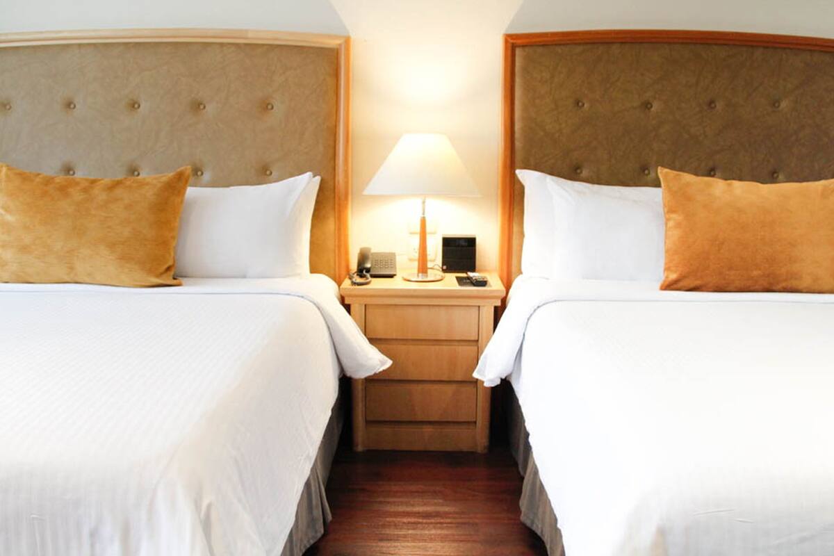 Room, 2 Queen Beds | In-room safe, desk, laptop workspace, soundproofing
