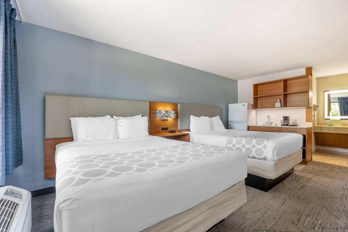 Room, 2 Queen Beds, Non Smoking | Pillow-top beds, blackout curtains, iron/ironing board (on request)