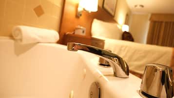 Executive Suite, 1 King Bed | Bathroom amenities | Combined shower/tub, rainfall showerhead, free toiletries, hair dryer