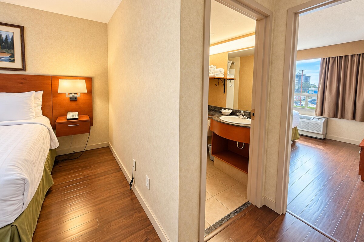 Suite, 2 Queen Beds, Non Smoking | Iron/ironing board, WiFi (free), bed sheets