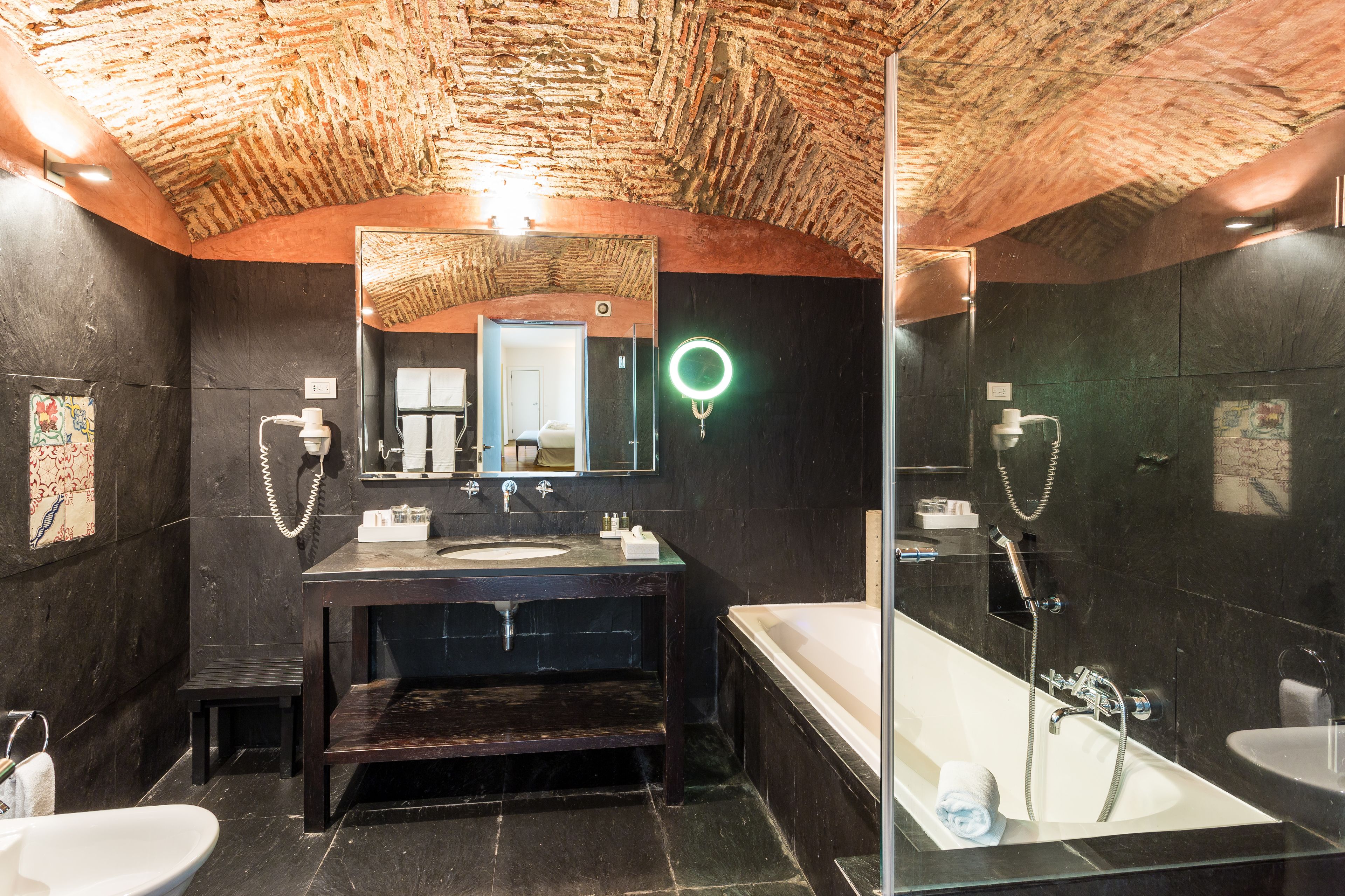 combined shower/bathtub, designer toiletries, hair dryer, bidet