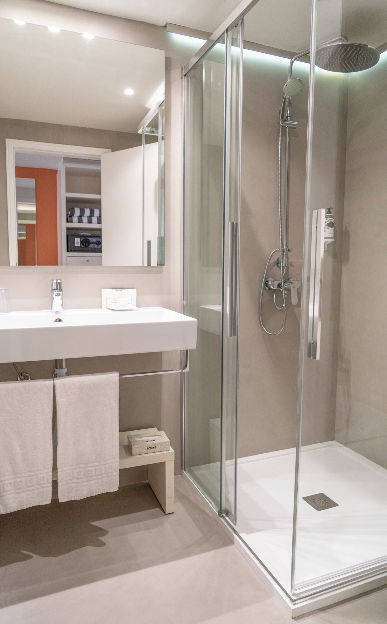 rainfall showerhead, eco-friendly toiletries, hair dryer, towels