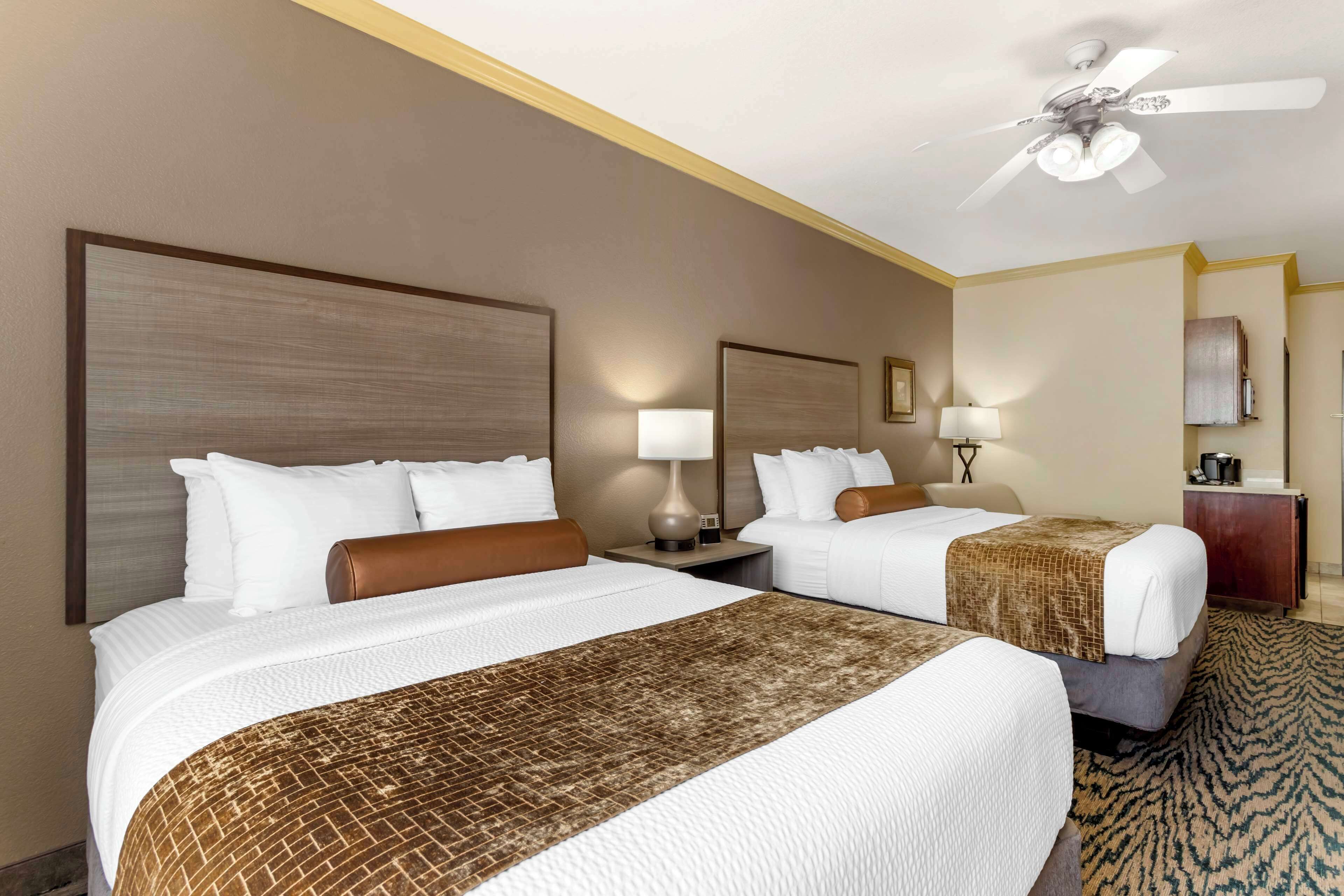 suite, 2 queen beds, non smoking, microwave | pillow-top beds, desk, laptop workspace, iron/ironing board