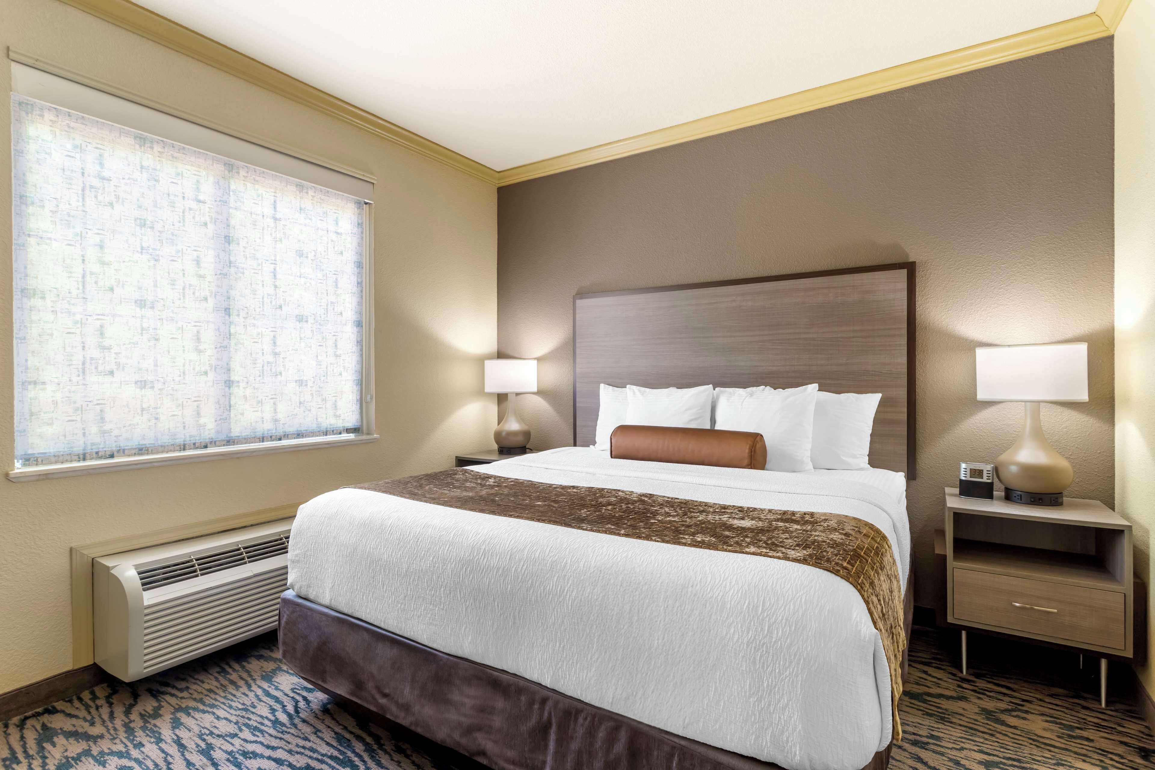 suite, multiple beds, non smoking, refrigerator & microwave (third bed is a sofabed) | pillow-top beds, desk, laptop workspace, iron/ironing board