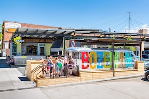 A food truck with colorful lettering and a sign that reads "BOZEMAN." - The LARK Bozeman (Bozeman)
