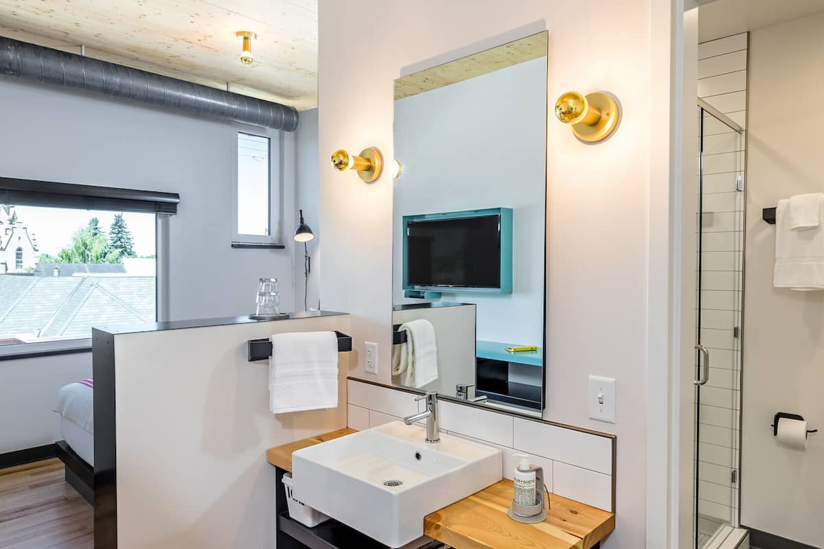 standard room, 1 queen bed (micro queen) | bathroom | shower, eco-friendly toiletries, hair dryer, bathrobes