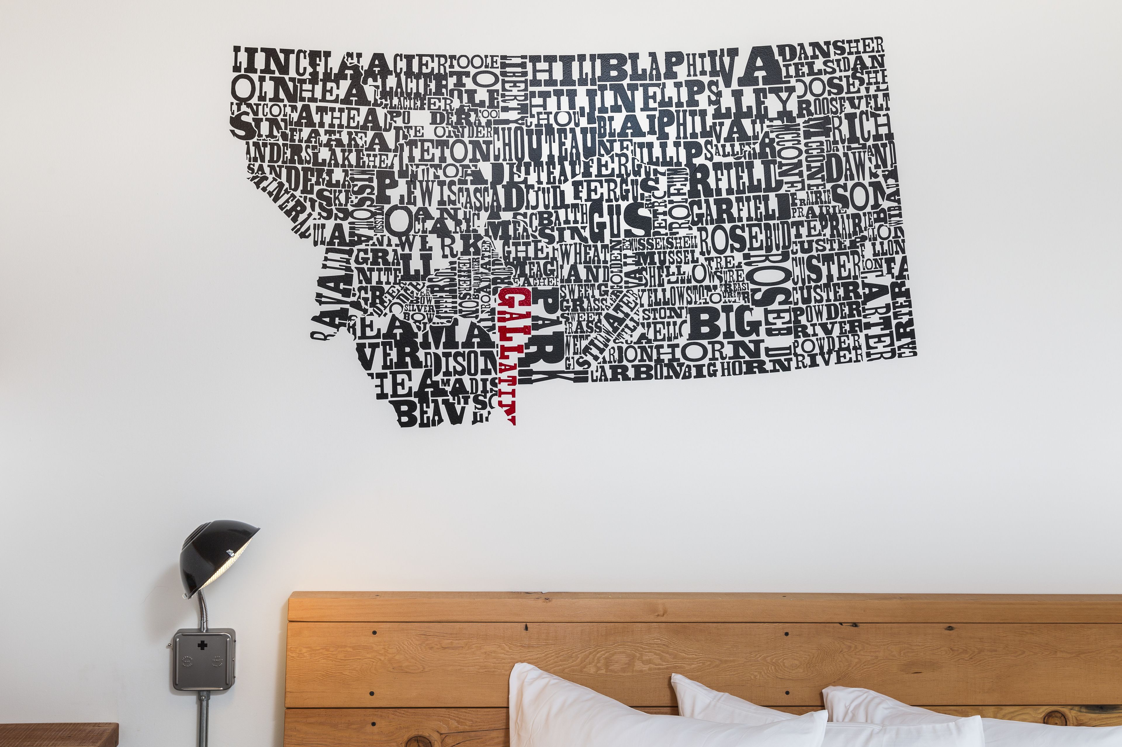 A wall with a word cloud design in the shape of a state.
