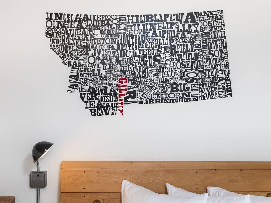 A wall with a word cloud design in the shape of a state.