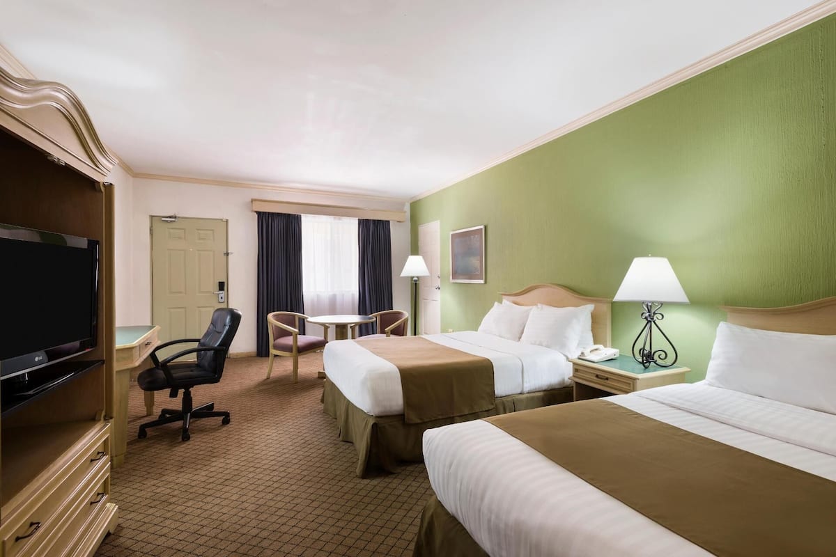 Premium bedding, down duvets, pillow-top beds, in-room safe