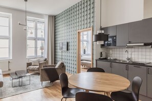 Suite, Sauna | Living area | TV - The More Hotel Mazetti (Malmö)