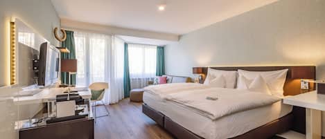 Luxe beddengoed, donsdekens, pillowtop-bedden, een minibar