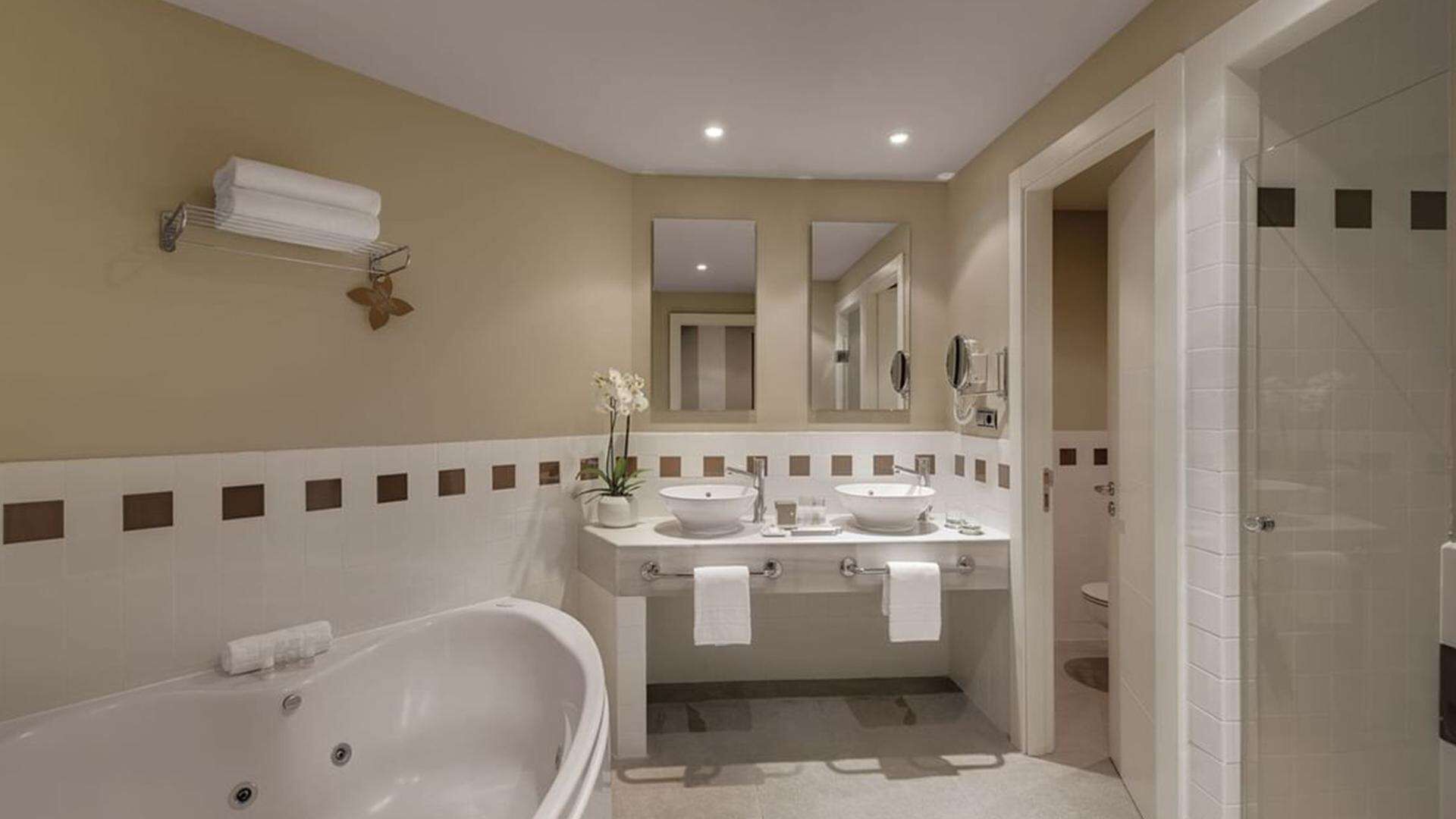 shower, hair dryer, bathrobes, slippers