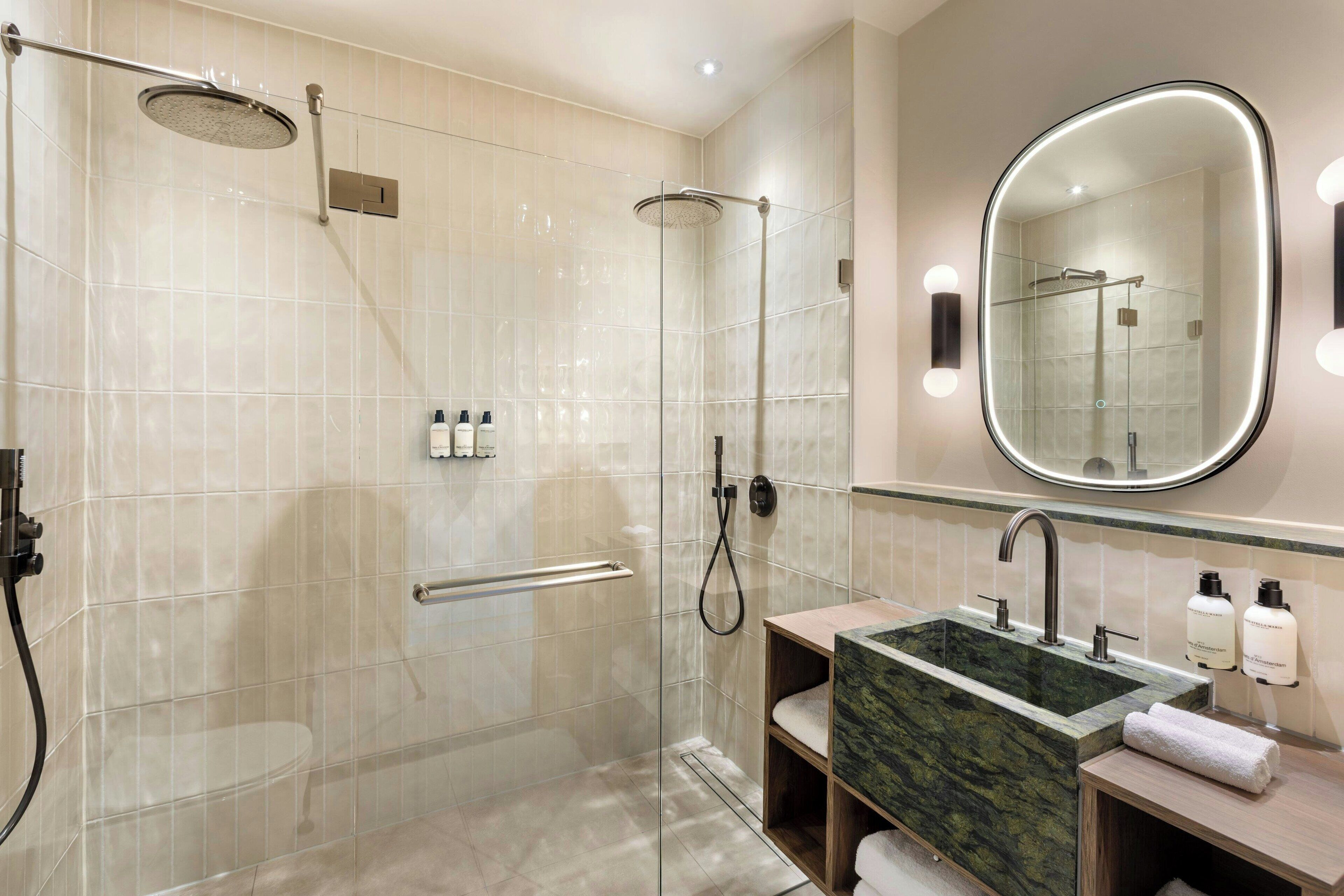 junior suite, 1 king bed, non smoking | bathroom | designer toiletries, hair dryer, bathrobes, slippers