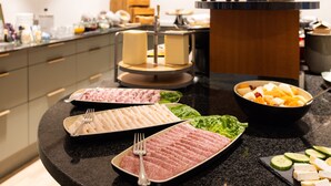 A buffet with various food items including meats, cheeses, and fruits. - Milling Hotel Ansgar (Odense)