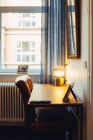 Desk, blackout drapes, iron/ironing board, cribs/infant beds