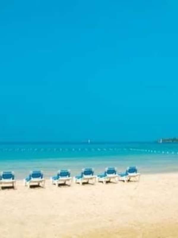 Private beach, white sand, sun loungers, beach umbrellas