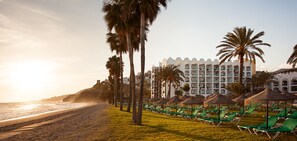 On the beach, sun loungers, beach umbrellas, beach towels