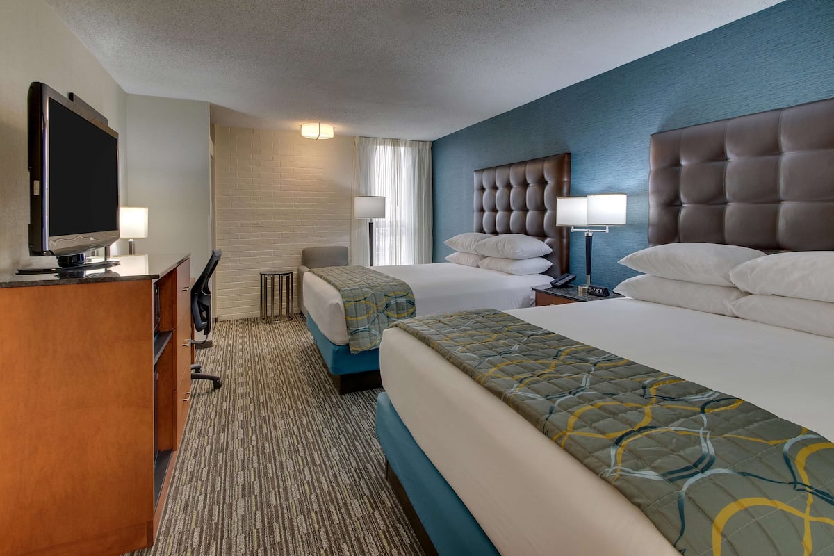 deluxe room, 2 queen beds, refrigerator & microwave | 1 bedroom, desk, blackout curtains, iron/ironing board