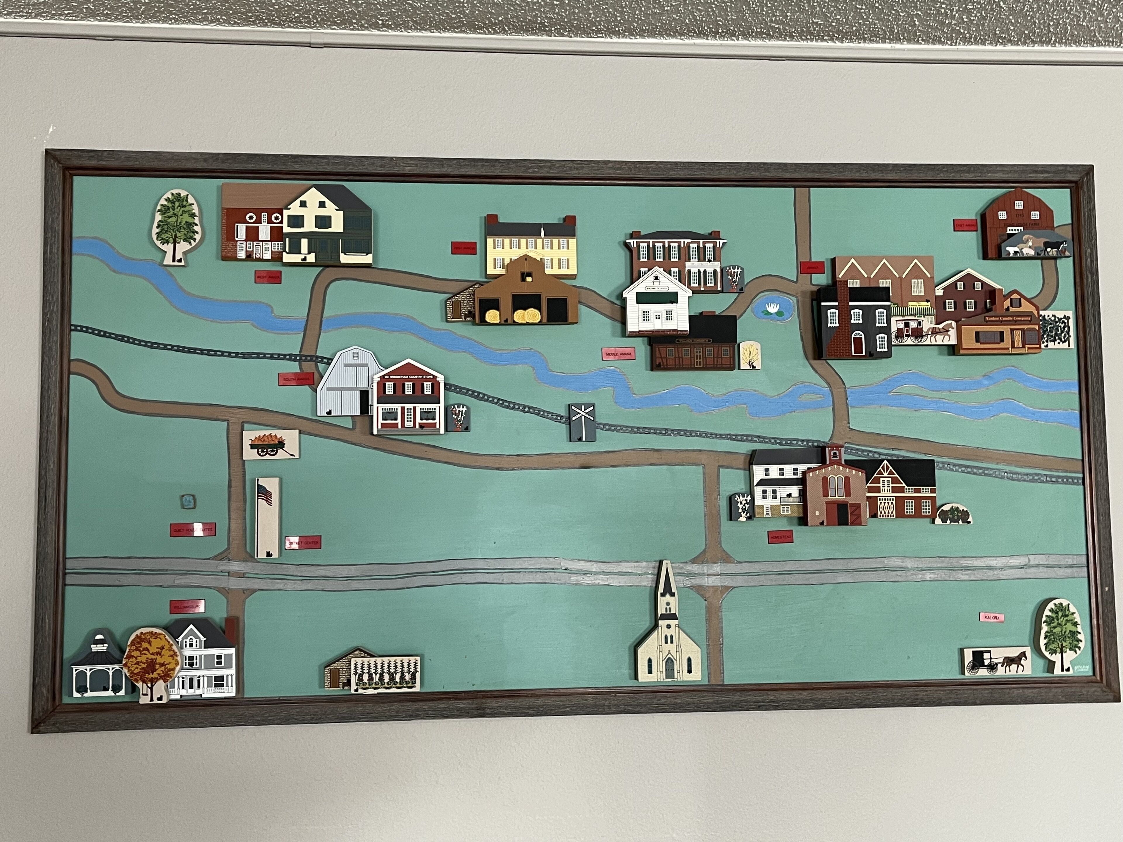 A detailed map of a town with various buildings, roads, and a church.