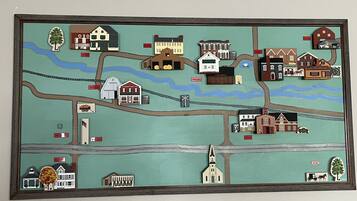 A detailed map of a town with various buildings, roads, and a church.