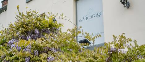 A building with a sign reading "The Vicarage."