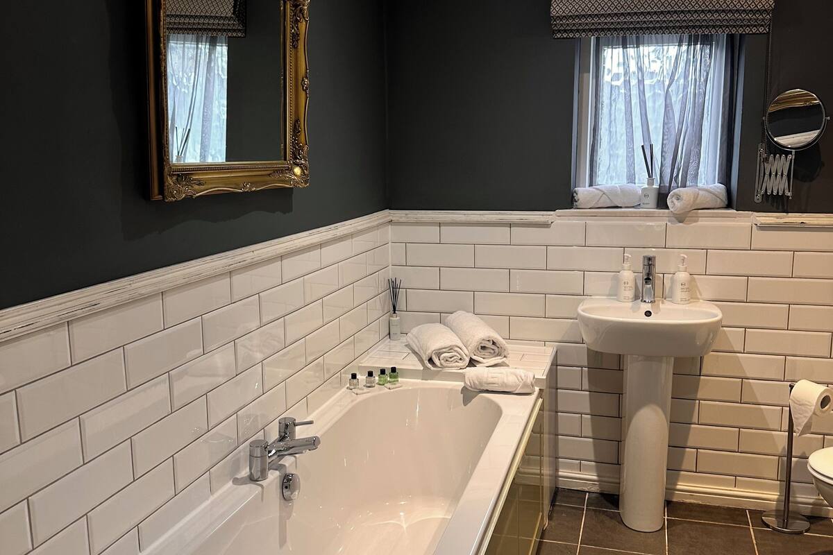 gawsworth suite | bathroom | combined shower/bathtub, deep-soaking bathtub, rainfall showerhead