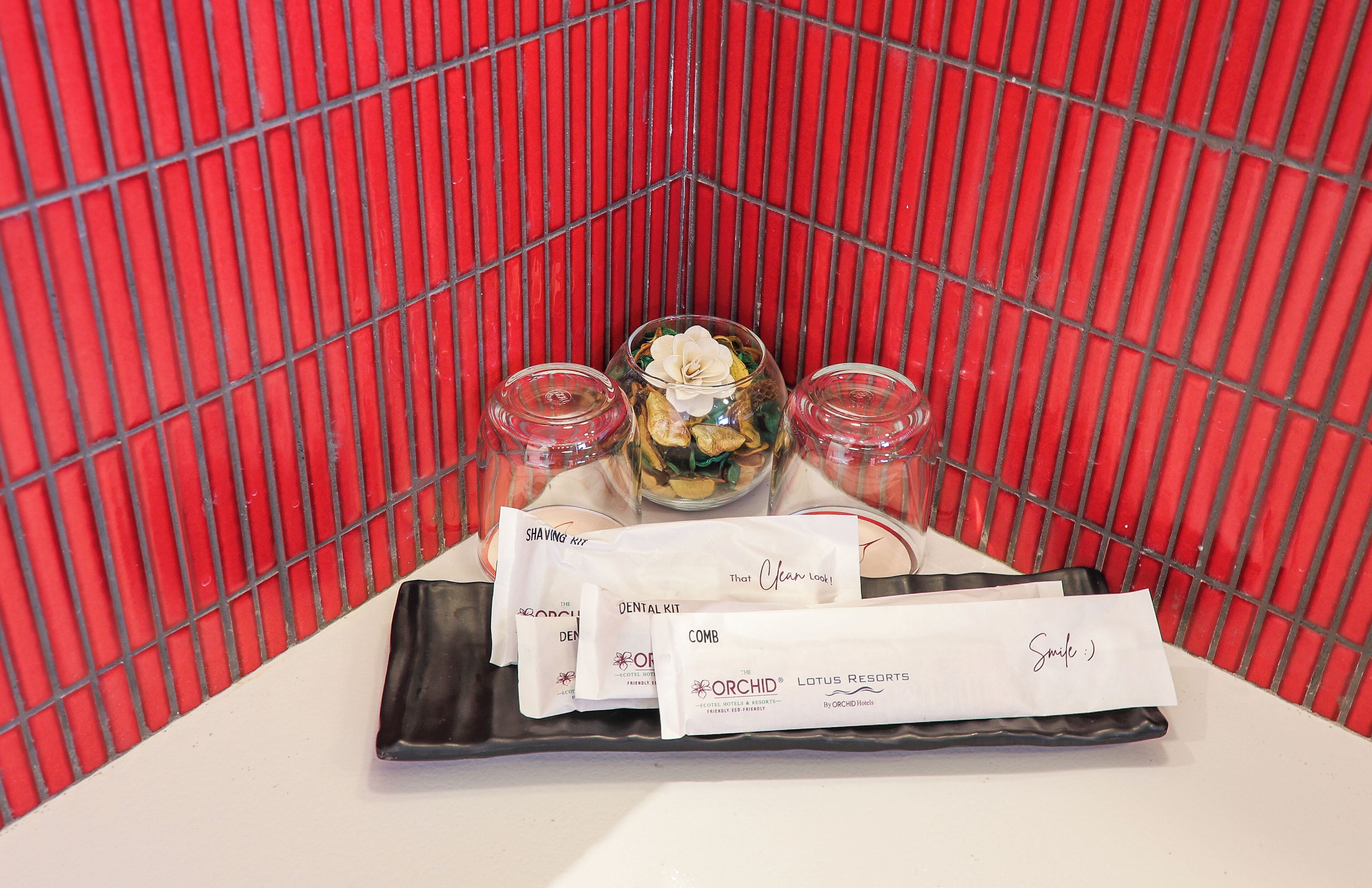 A tray with shaving kits and a note from Lotus Resorts.