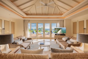 3 Bedroom Signature Villa (RV24) | Living area | 37-inch LCD TV with satellite channels, TV, fireplace - Trisara Villas & Residences Phuket (Choeng Thale)
