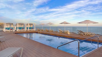 2 outdoor pools, pool umbrellas, pool loungers