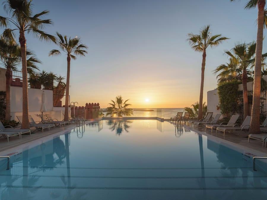 Indoor pool, outdoor pool, open 8:00 AM to 8:00 PM, pool umbrellas