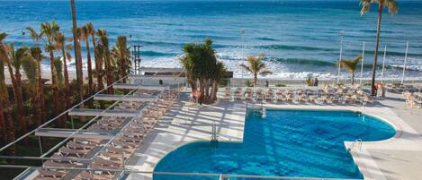 Indoor pool, outdoor pool, pool umbrellas, pool loungers